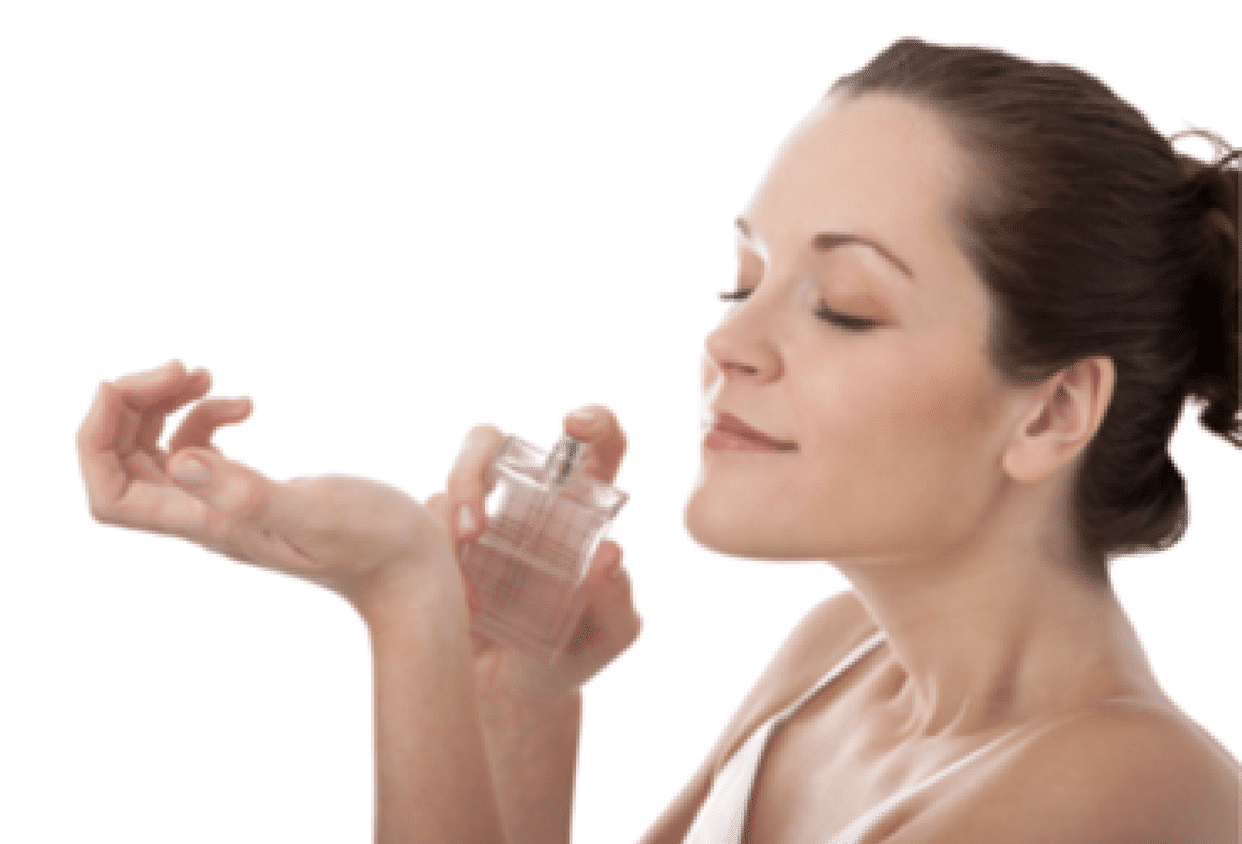 Woman smelling perfume on her wrist